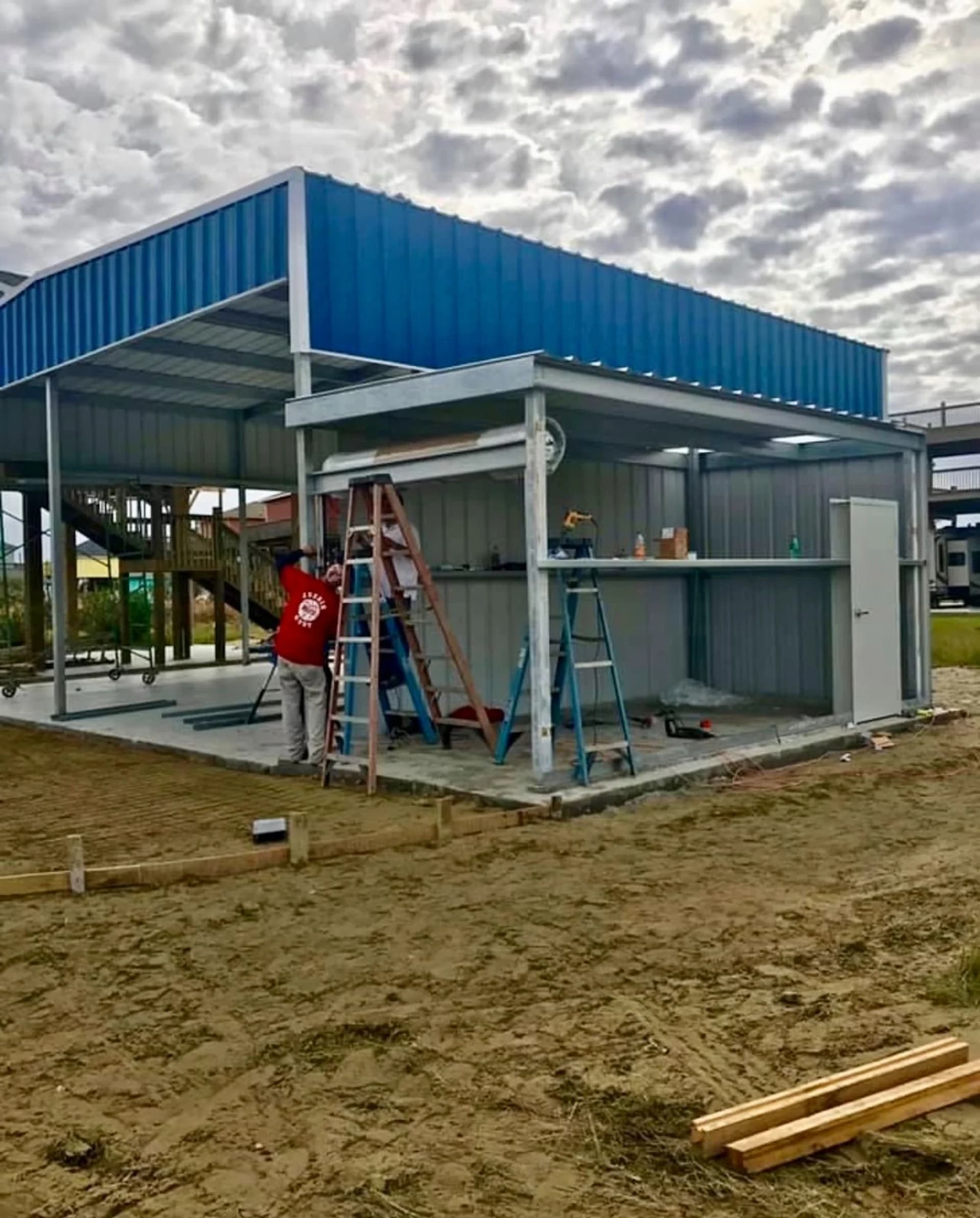 Custom two-tone metal building under construction