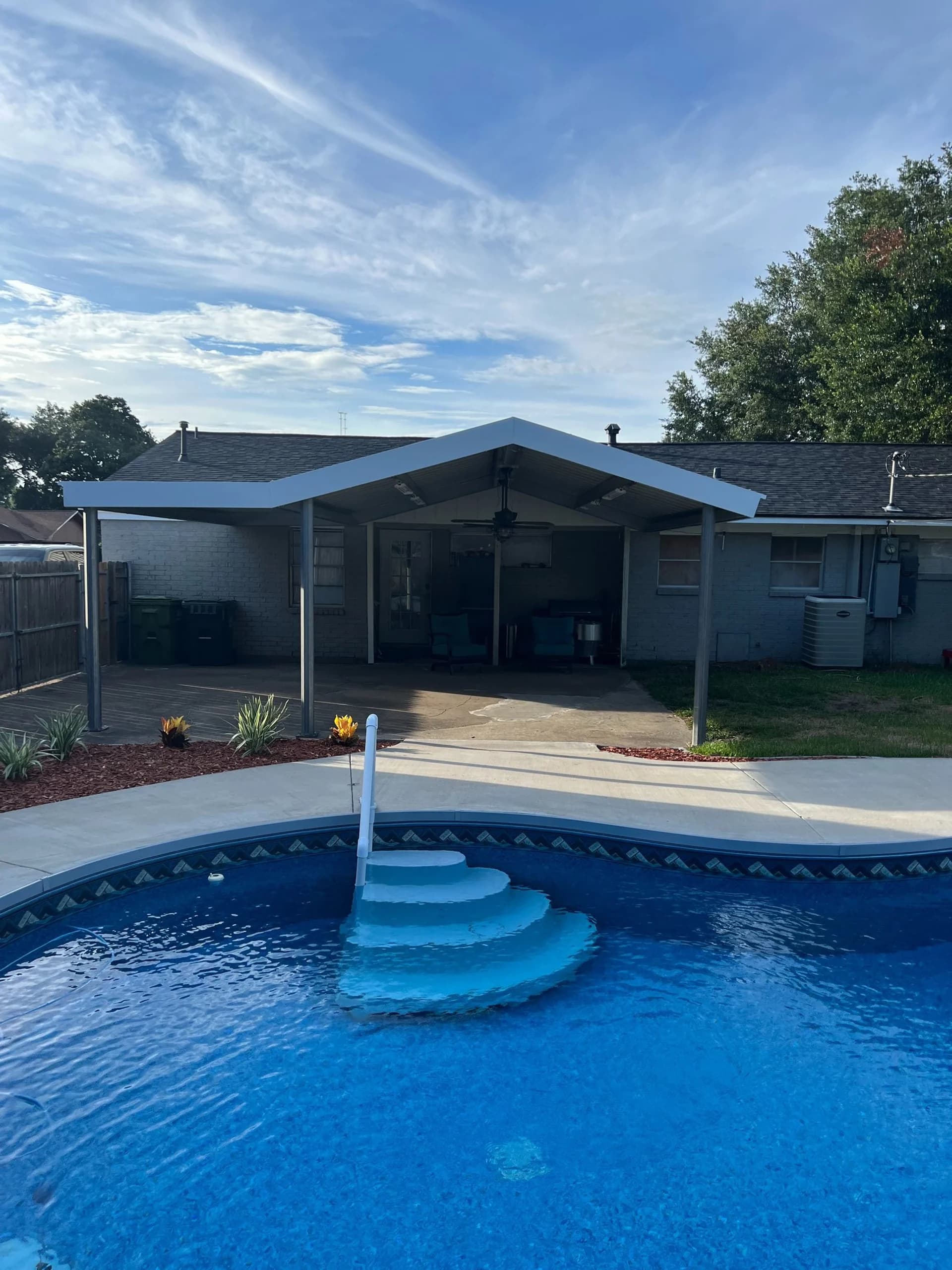Poolside patio cover attached to a Houston-area home